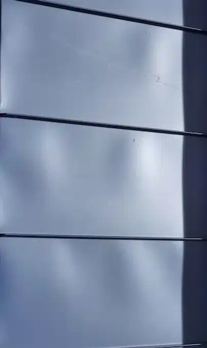 Dark overlapping metal panels
