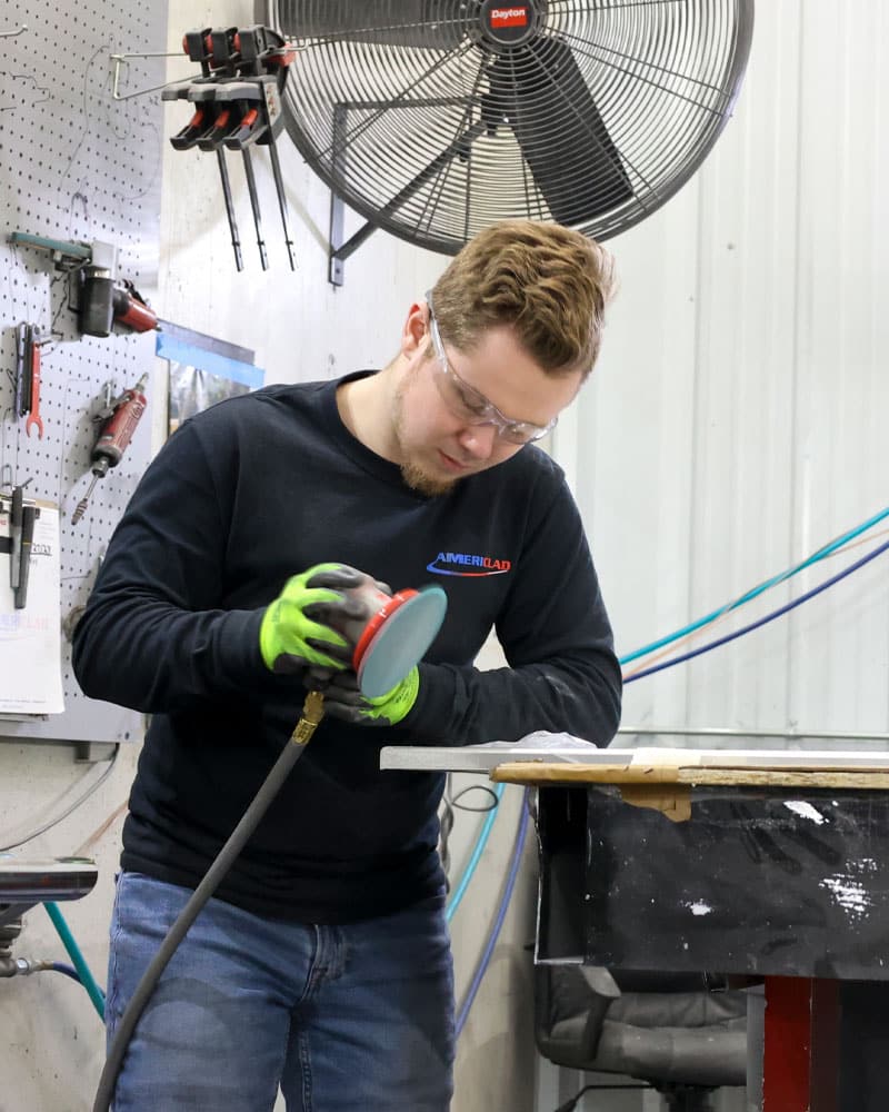 Employee Using Pneumatic Sander