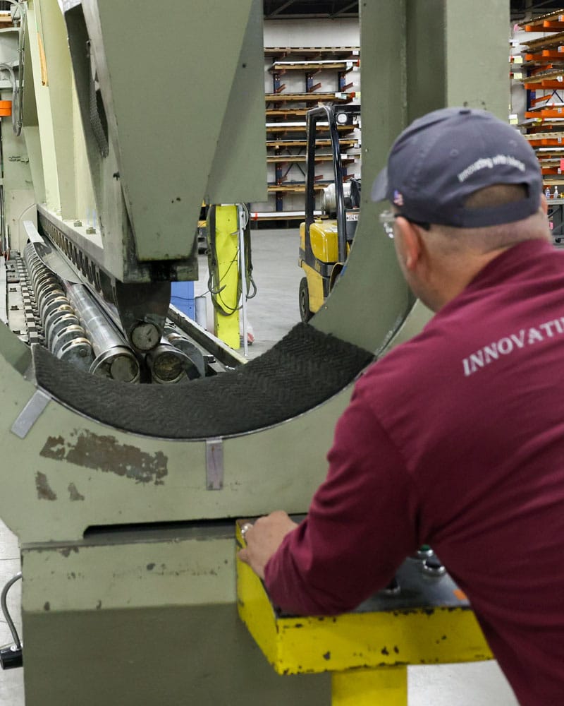 Worker Using Metal Roller