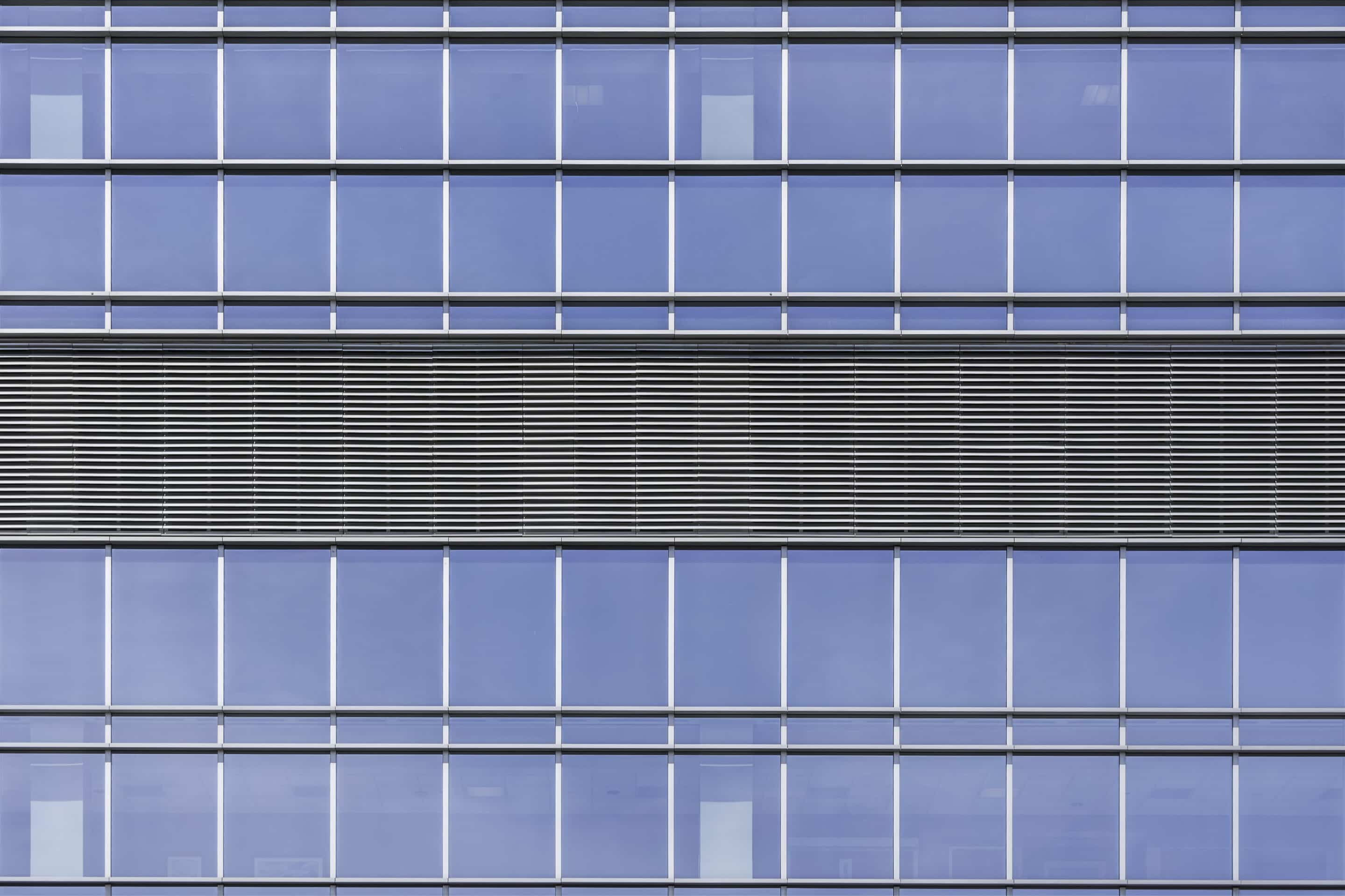 Image of an Americlad building on a sunny day that displays louvers and a louver systems.